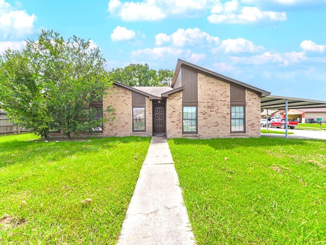 view of front facade with a front lawn and a carport