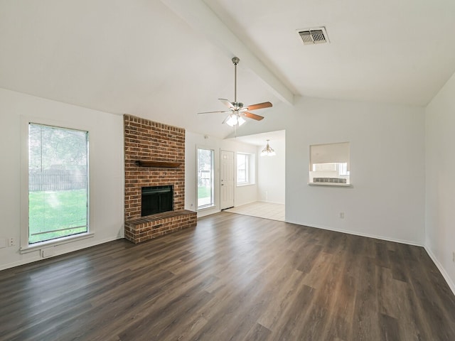 unfurnished living room featuring a fireplace, ceiling fan, lofted ceiling with beams, hardwood / wood-style flooring, and brick wall