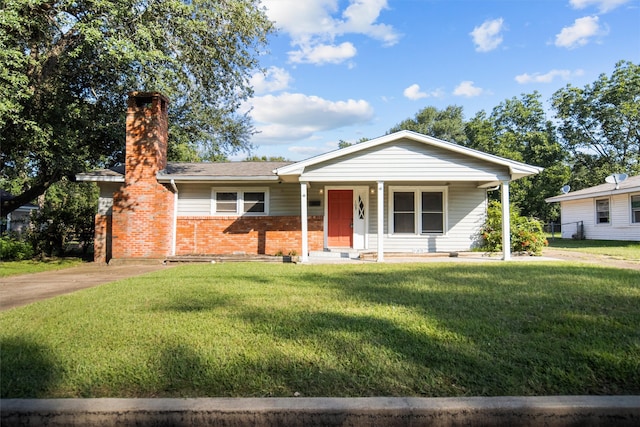 single story home featuring a front lawn and covered porch