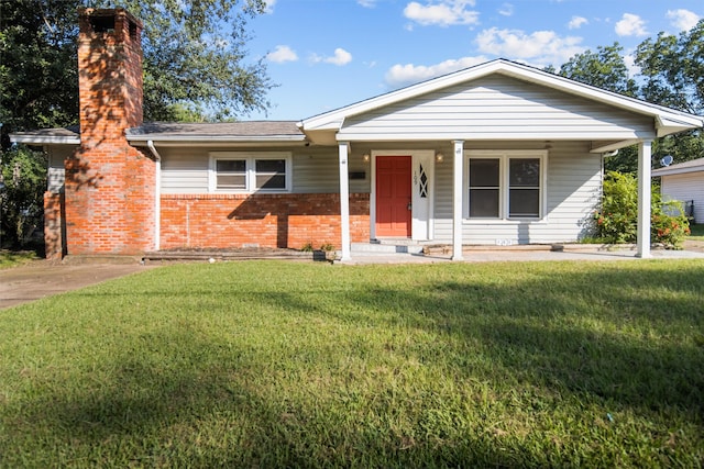 ranch-style house with covered porch and a front lawn