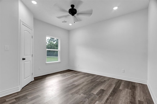 empty room with ceiling fan and hardwood / wood-style flooring