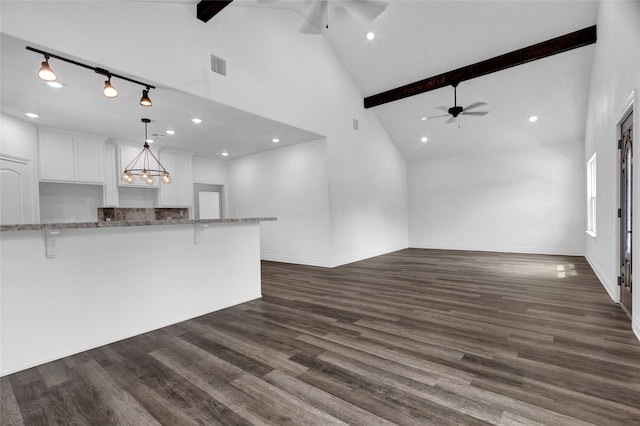 unfurnished living room with beam ceiling, ceiling fan, high vaulted ceiling, and dark hardwood / wood-style flooring