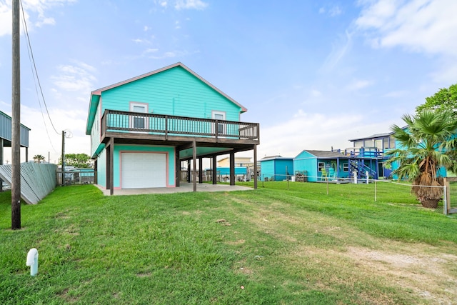 back of property featuring a deck and a yard