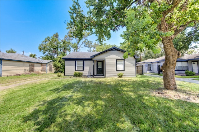 ranch-style house with a front lawn