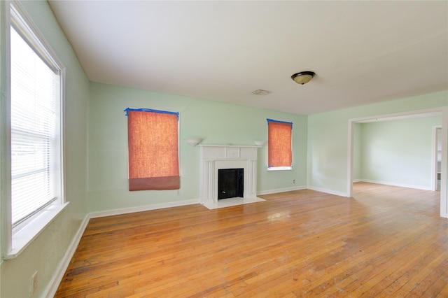 unfurnished living room featuring light hardwood / wood-style flooring