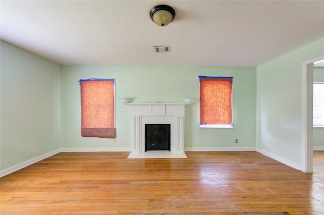 unfurnished living room with light wood-type flooring