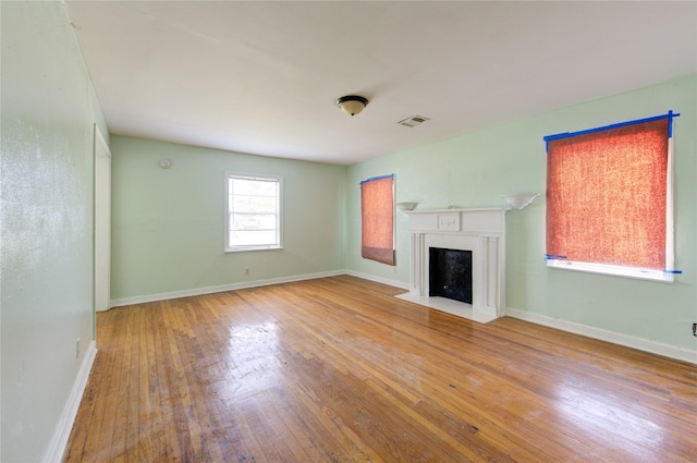 unfurnished living room with light hardwood / wood-style flooring