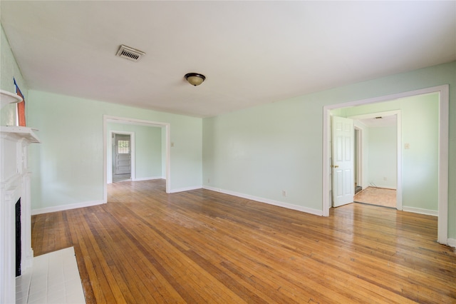 unfurnished living room with light hardwood / wood-style flooring