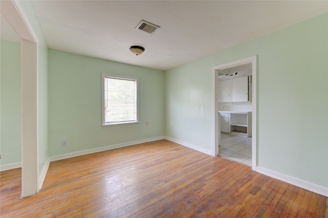 unfurnished room featuring light hardwood / wood-style flooring