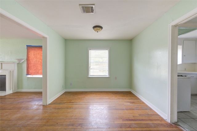 unfurnished room featuring hardwood / wood-style flooring