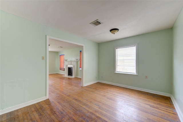 empty room with hardwood / wood-style floors