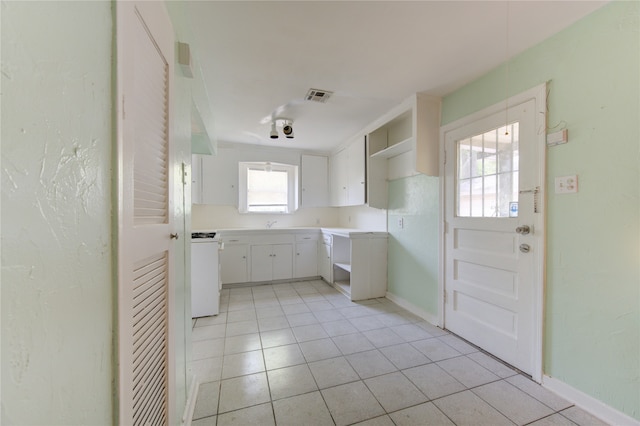 bathroom with tile patterned floors