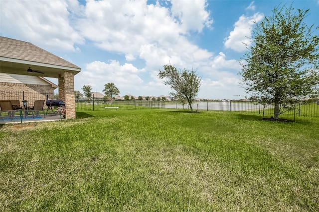 view of yard with a patio and ceiling fan