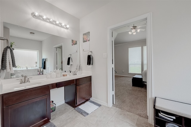 bathroom featuring ceiling fan, vanity, ornamental molding, and tile patterned floors