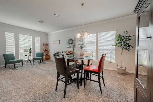 carpeted dining area featuring ornamental molding, an inviting chandelier, and a wealth of natural light