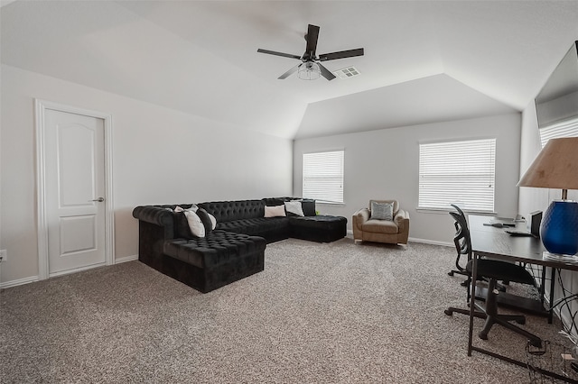 carpeted office featuring ceiling fan, lofted ceiling, and a healthy amount of sunlight