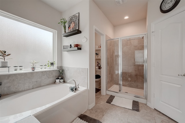 bathroom featuring independent shower and bath and tile patterned floors