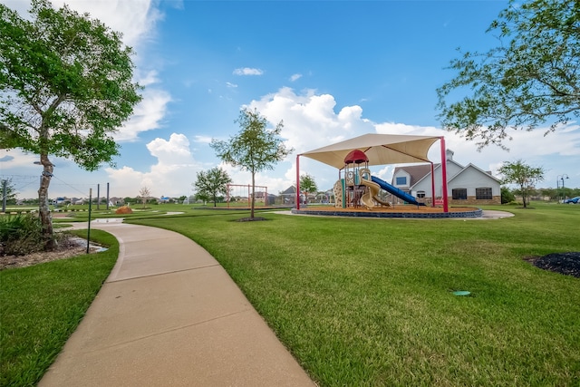 surrounding community with a playground and a yard