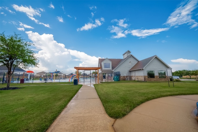 surrounding community featuring a lawn and a water view