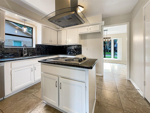 kitchen featuring sink, white cabinetry, island range hood, a kitchen island, and decorative light fixtures