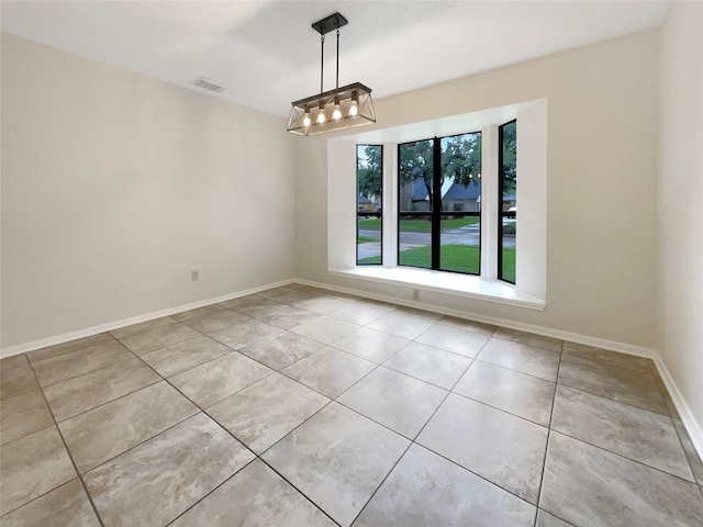 unfurnished dining area featuring light tile patterned floors