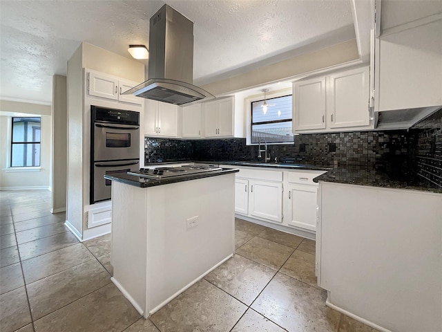 kitchen featuring sink, white cabinetry, stainless steel appliances, a center island, and island range hood