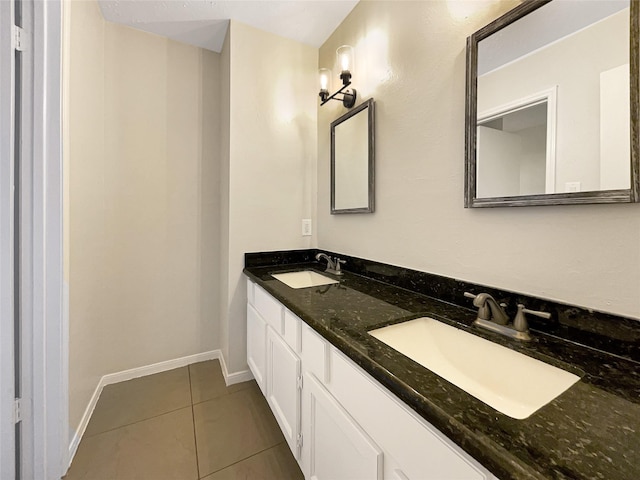 bathroom with tile patterned flooring and vanity