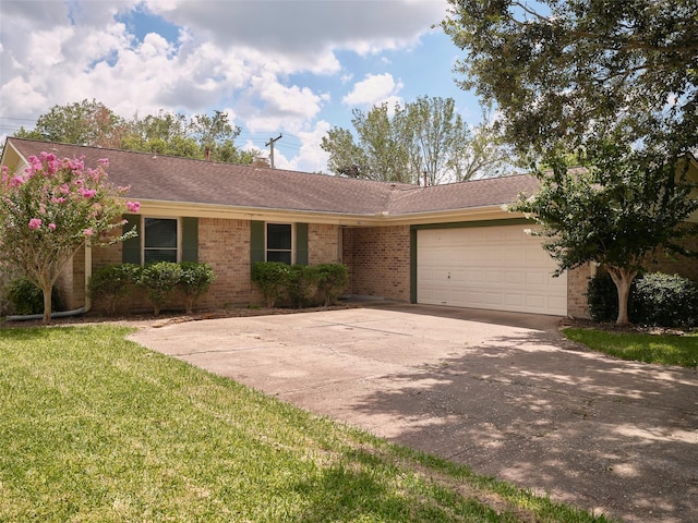 ranch-style house with a garage and a front yard