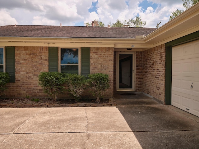 property entrance with a garage