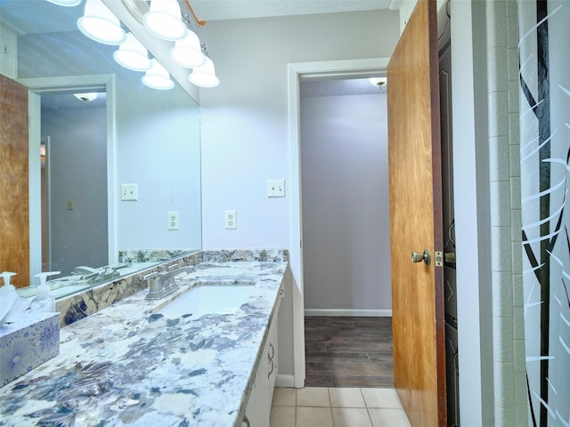 bathroom with vanity and tile patterned flooring