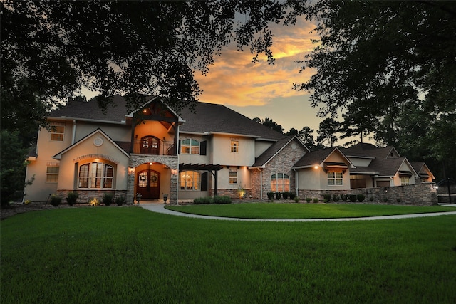 view of front of house with a yard