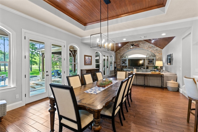 dining room featuring hardwood / wood-style floors, a wealth of natural light, and wooden ceiling