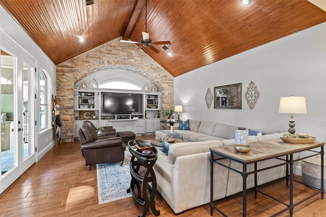 living room with built in shelves, wood ceiling, high vaulted ceiling, light wood-type flooring, and ceiling fan