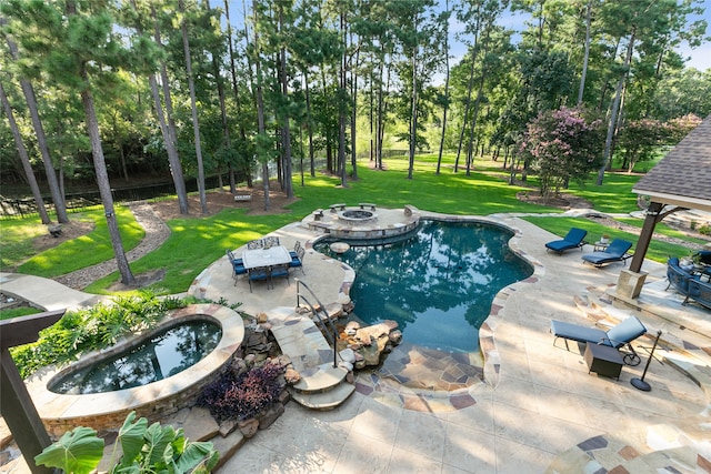 view of pool with a patio, an outdoor fire pit, and an in ground hot tub