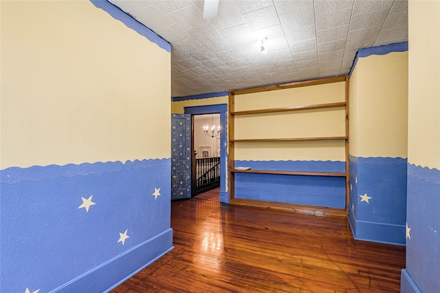 unfurnished bedroom featuring dark hardwood / wood-style flooring