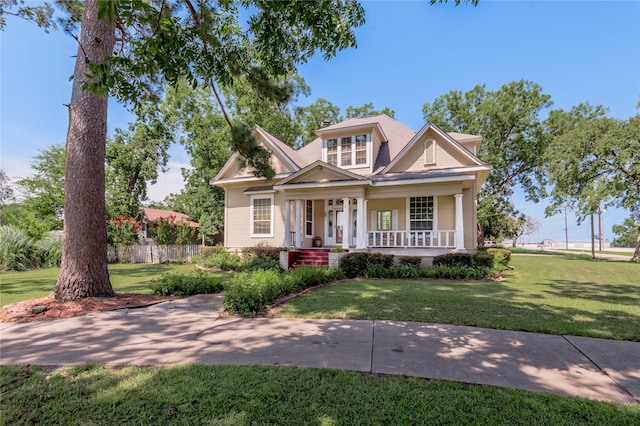 craftsman house with a front lawn and covered porch