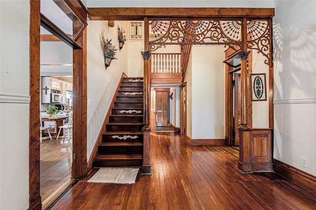 stairway with hardwood / wood-style flooring