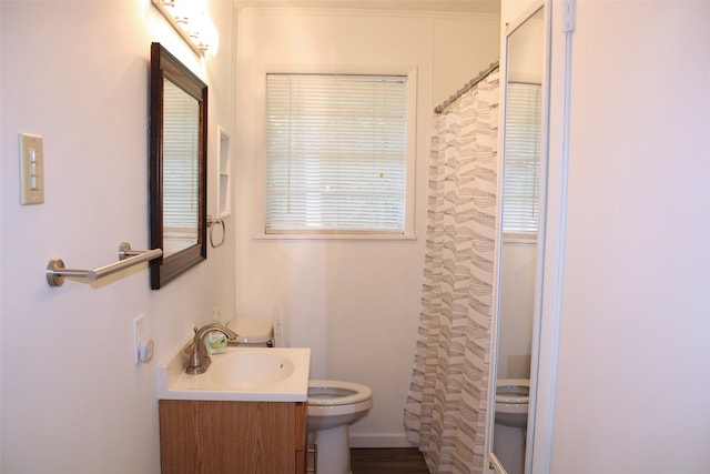 bathroom with a shower with curtain, vanity, and toilet