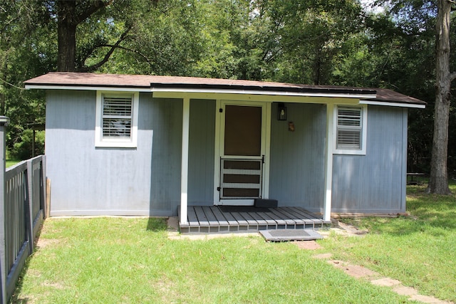 view of outbuilding with a lawn