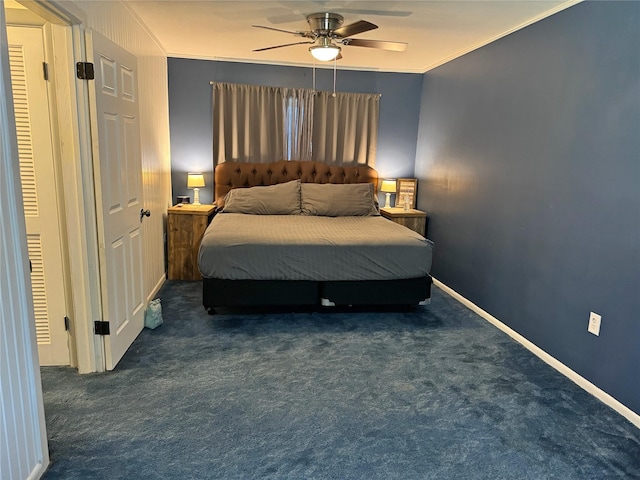 bedroom featuring ceiling fan, dark carpet, and crown molding