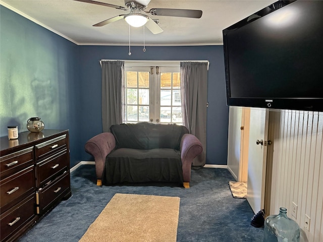 interior space with ceiling fan, french doors, dark carpet, and ornamental molding