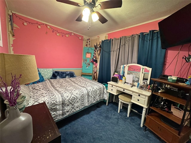 bedroom with a textured ceiling, dark carpet, ceiling fan, and crown molding