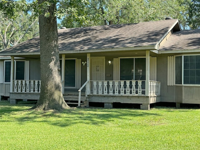 view of front of home with a front yard and a porch