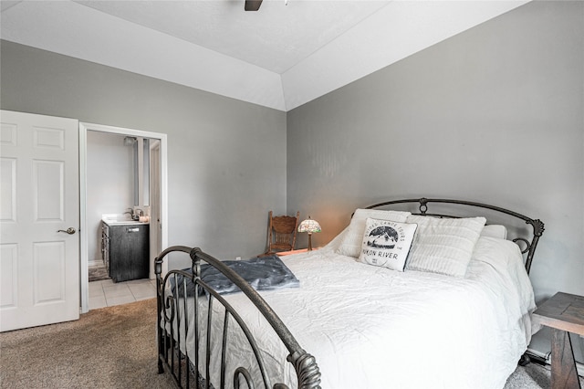 tiled bedroom featuring ceiling fan