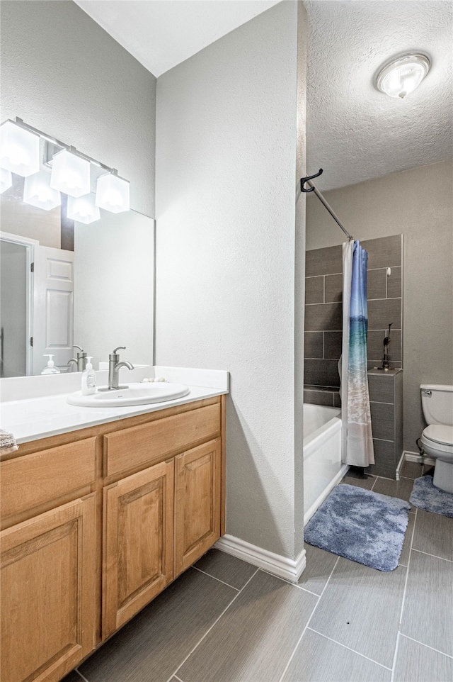 full bathroom with a textured ceiling, toilet, tile patterned floors, shower / bathtub combination with curtain, and vanity