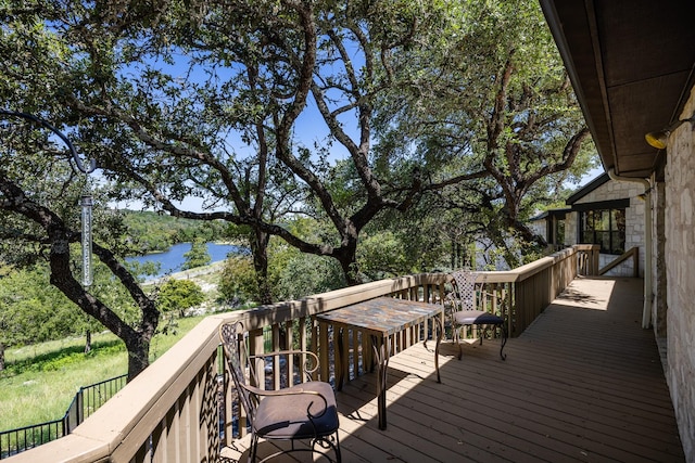 wooden terrace with a water view