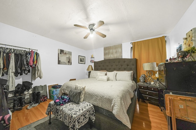 bedroom featuring hardwood / wood-style floors and ceiling fan