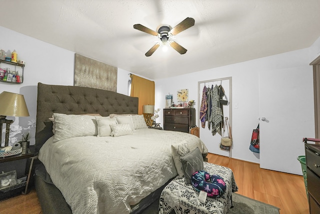 bedroom featuring ceiling fan and wood-type flooring