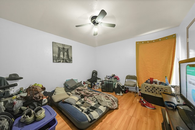 bedroom featuring hardwood / wood-style floors and ceiling fan