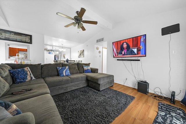 living room featuring wood-type flooring, ceiling fan with notable chandelier, and lofted ceiling with beams